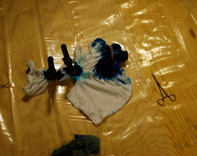 Pleated diagonal dyed areas clamped